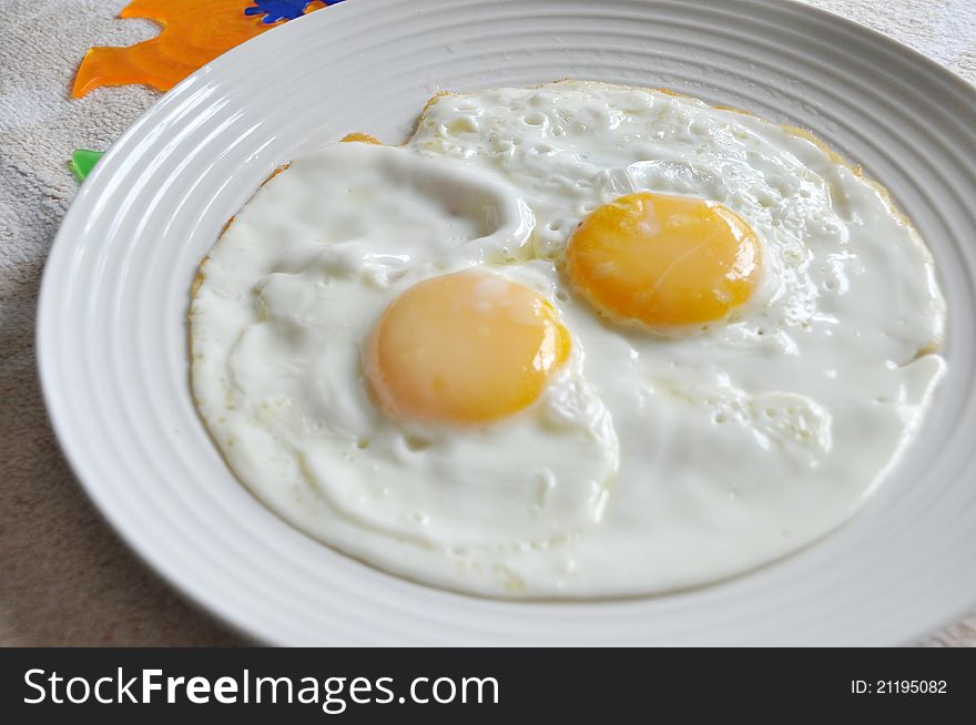 Close up of fried egg on the plate
