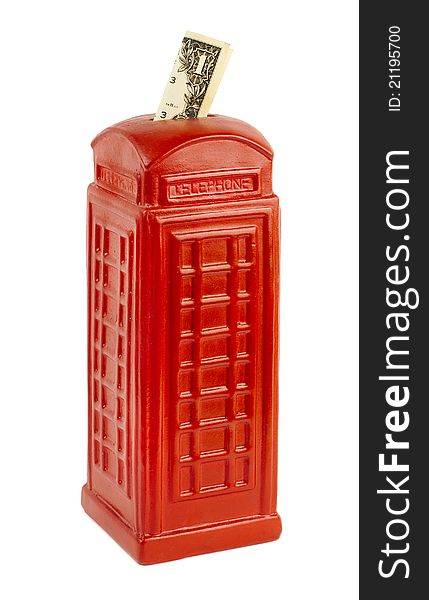 Red piggy bank in the shape of a classic English phone booth. Red piggy bank in the shape of a classic English phone booth
