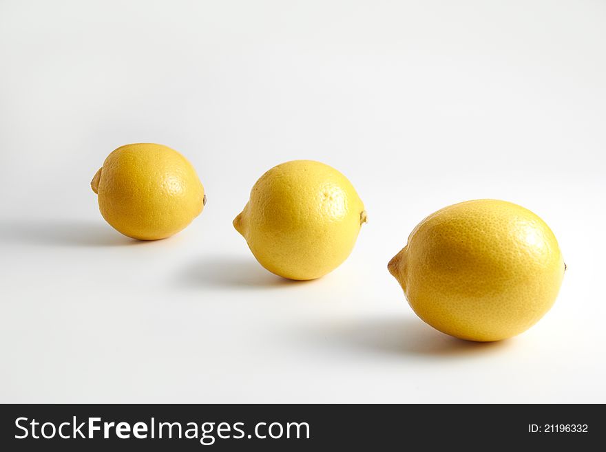 Three lemons on clean white background