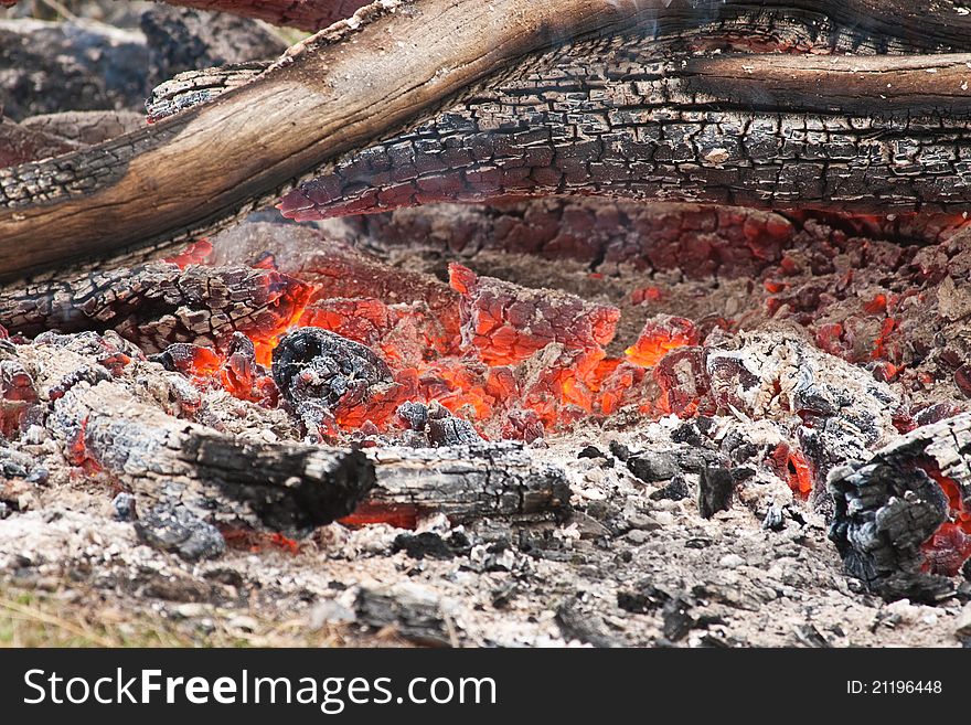 Hot coals from a camp fire in outback Australia