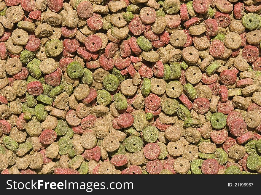 Background of dry cat food, small nuggets of colors. Background of dry cat food, small nuggets of colors