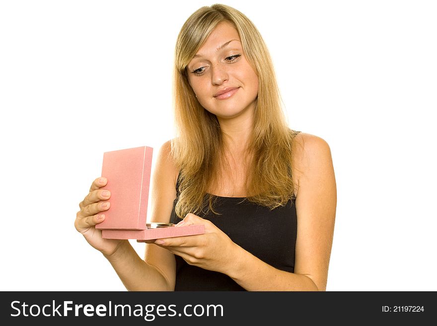 Bautiful young girl opens a gift box. Expressed surprise and shock. Lots of copyspace and room for text on this isolate