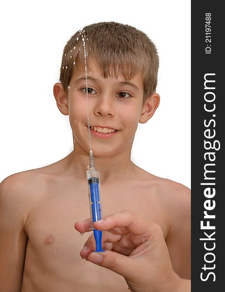 The boy and the syringe. Isolated on white background