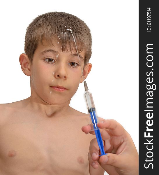 The boy and the syringe. Isolated on white background