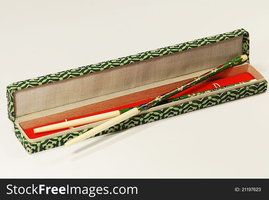 Close view of a open box with japanese eating sticks. Close view of a open box with japanese eating sticks