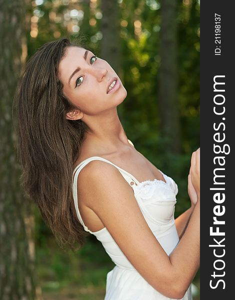 Girl near tree in summer forest. Girl near tree in summer forest