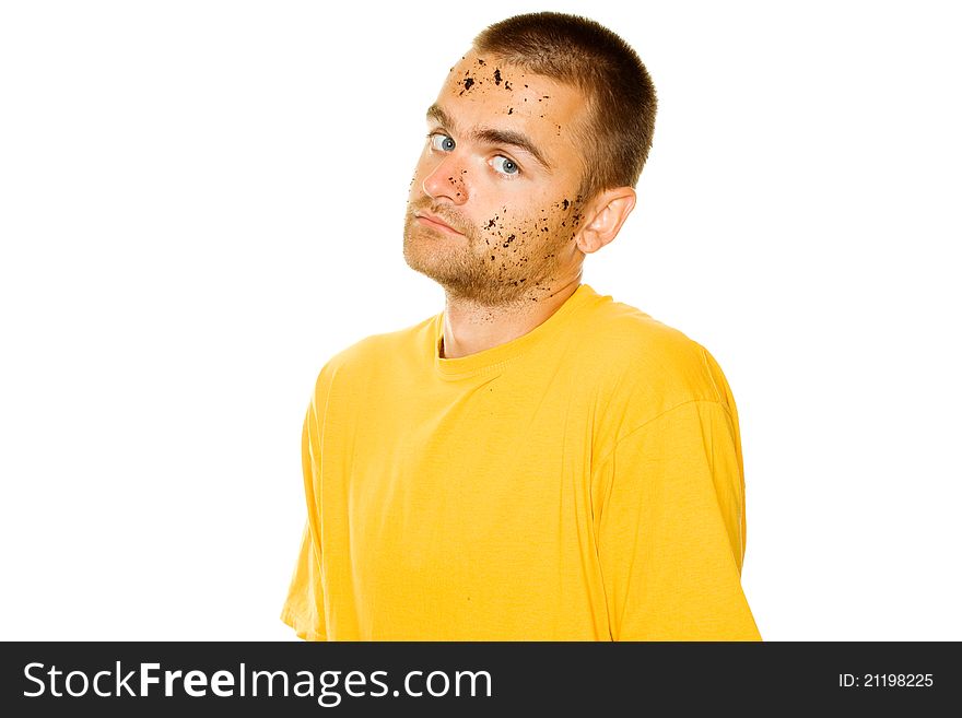 Handsome young man, his face and hands stained the ground. Guy pleased his hands raised up. Isolated. Handsome young man, his face and hands stained the ground. Guy pleased his hands raised up. Isolated