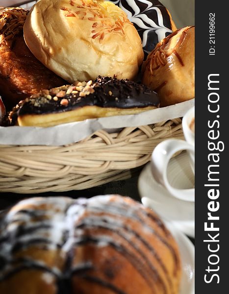 Delicious bread sweetened with multi flavour taste served as the main menu and Chocolate bread as blurred foreground. Great images for food and beverages article or any design involving food and drinks. Delicious bread sweetened with multi flavour taste served as the main menu and Chocolate bread as blurred foreground. Great images for food and beverages article or any design involving food and drinks.