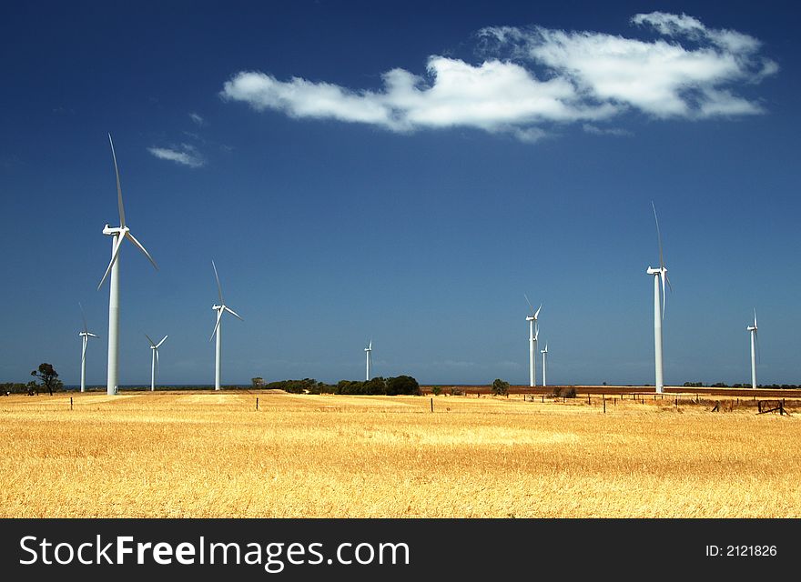 Countryside landscape with wind electricity farm against the backdrop of blue sky and white cloud. Countryside landscape with wind electricity farm against the backdrop of blue sky and white cloud