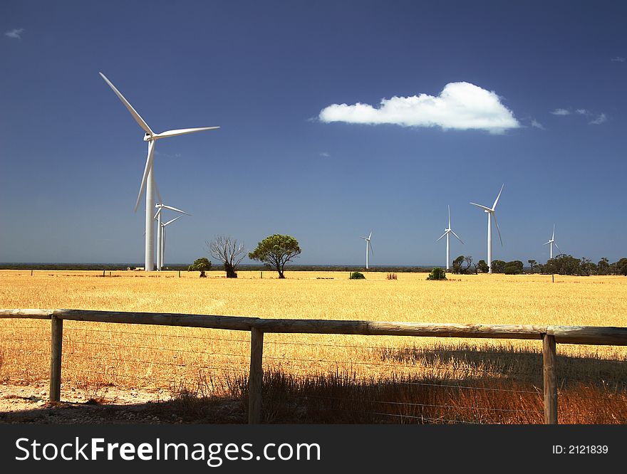 Countryside landscape with wind electricity farm against the backdrop of blue sky and white cloud. Countryside landscape with wind electricity farm against the backdrop of blue sky and white cloud