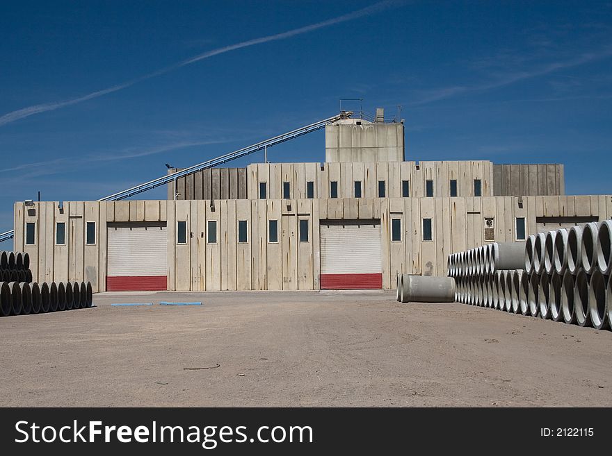 A cement or concrete conduit manufacturing plant. A cement or concrete conduit manufacturing plant