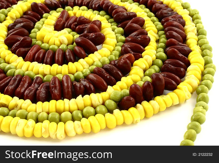 Close view at part of yellow, green and red vegetables spiral. Close view at part of yellow, green and red vegetables spiral