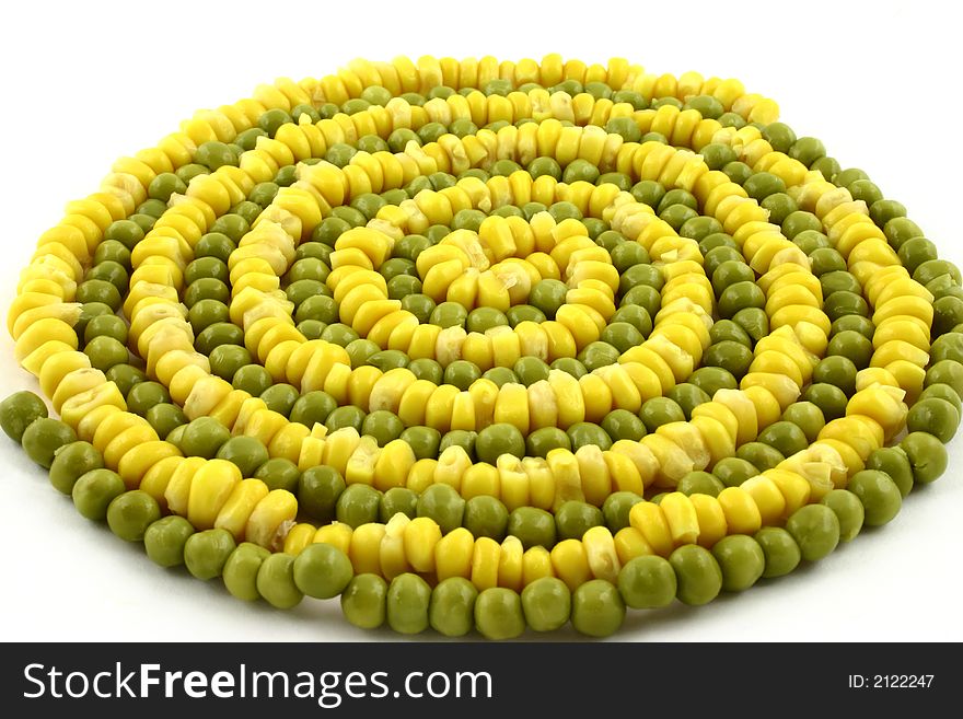 Some green peas and corn put together in a circle. Some green peas and corn put together in a circle