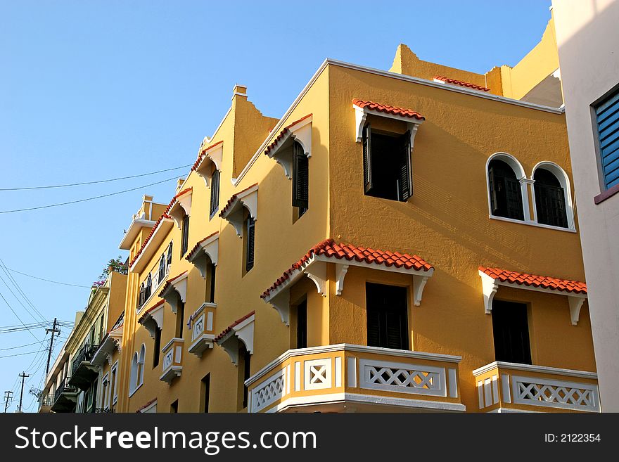 Amber yellow stucco commercial and residential building. Amber yellow stucco commercial and residential building