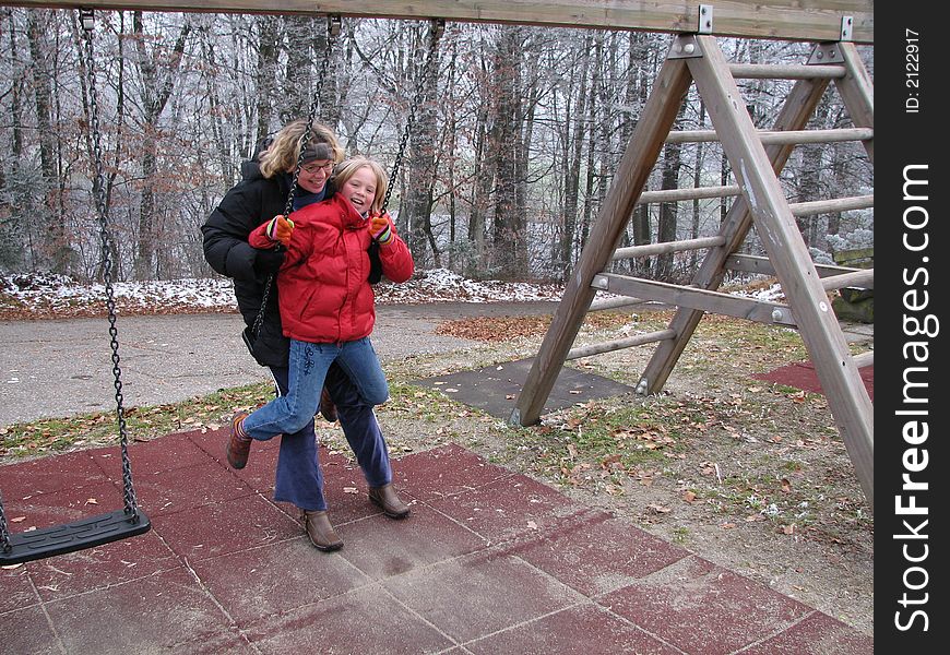 Young girl feeding a horse