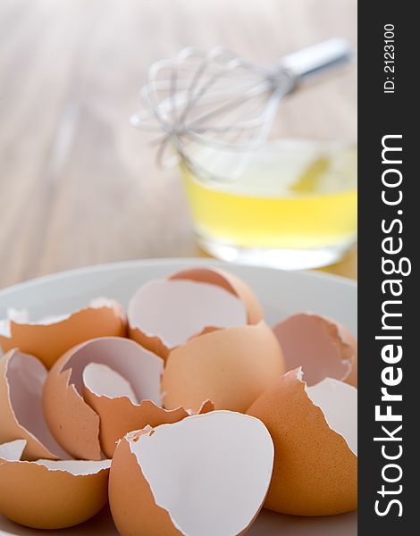 Raw egg whites just cracked into a glass bowl waiting to be whisked