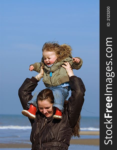 Mother And Child On The Beach