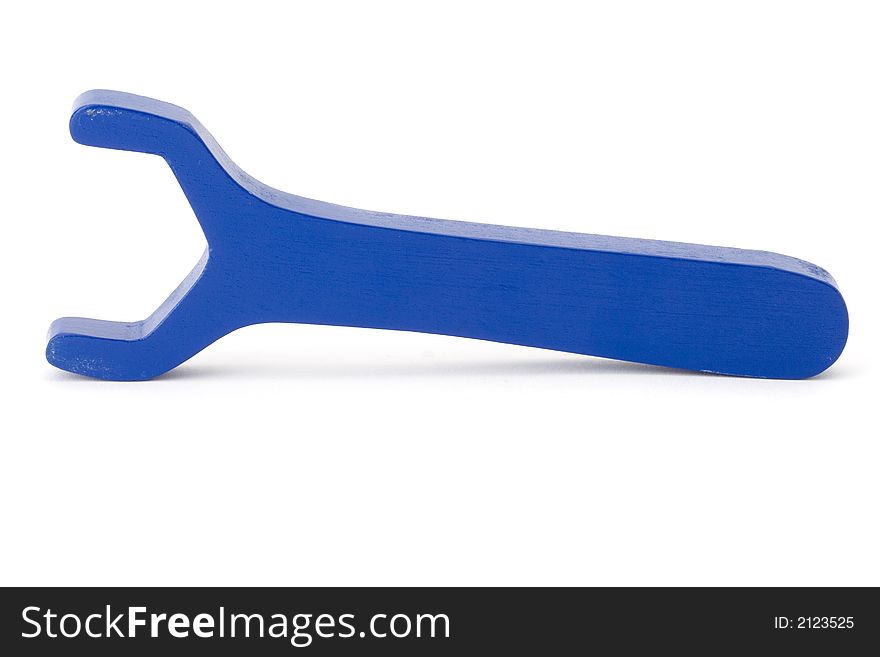 Blue wooden toy wrench on white