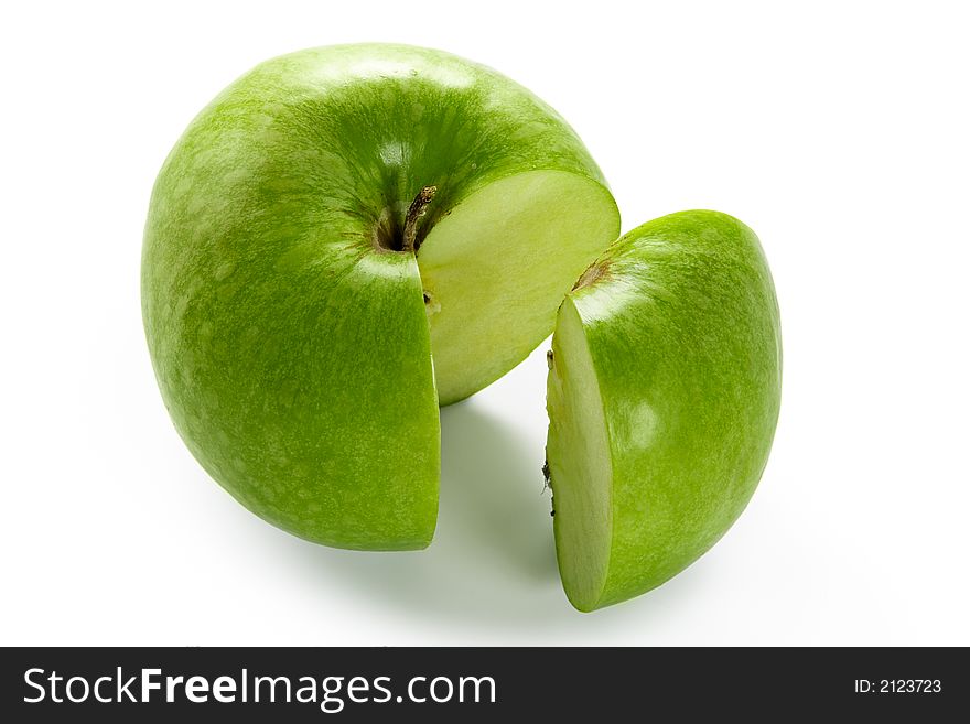 Big green apple with cut out one segment