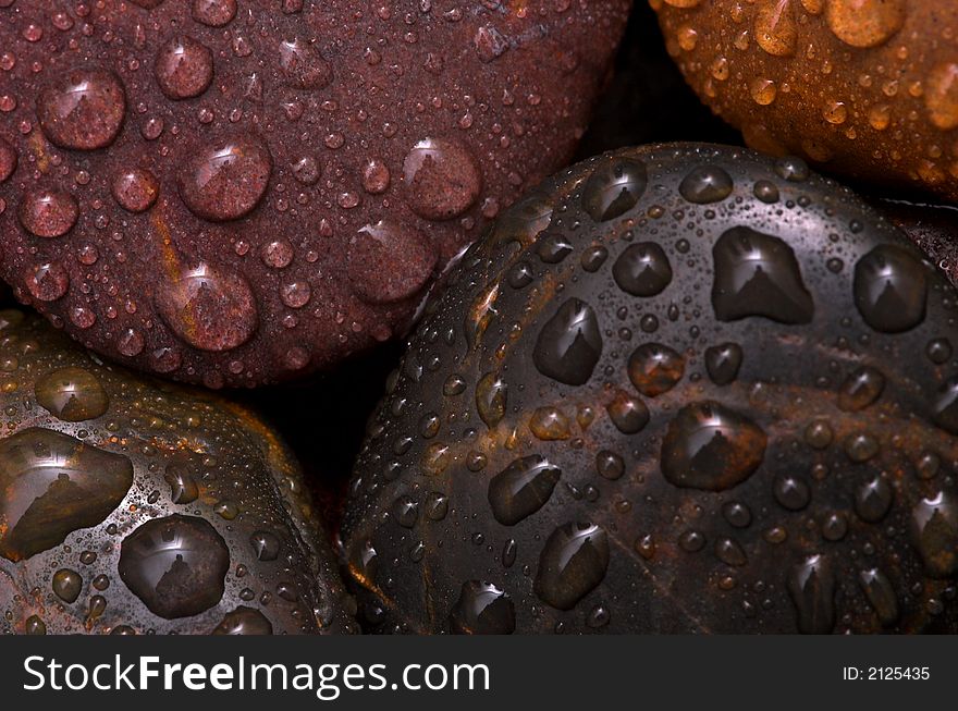 Assorted pebbles with water droplets. Assorted pebbles with water droplets