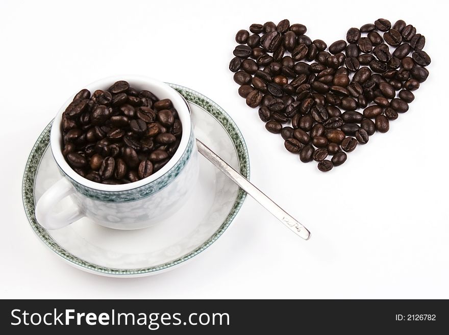 Coffee bean in love shape with cup. Coffee bean in love shape with cup.