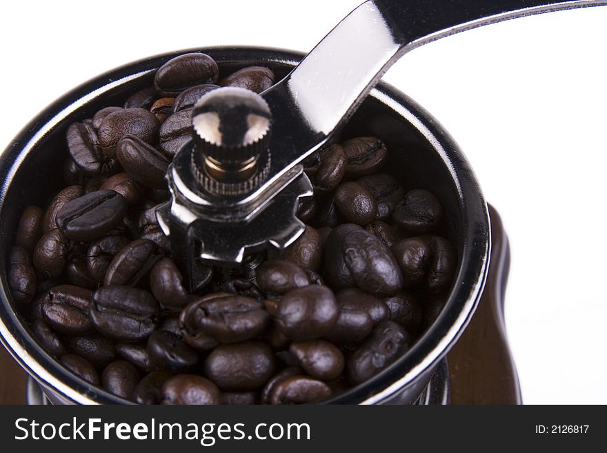 Close up of coffee bean and grinder. Close up of coffee bean and grinder.