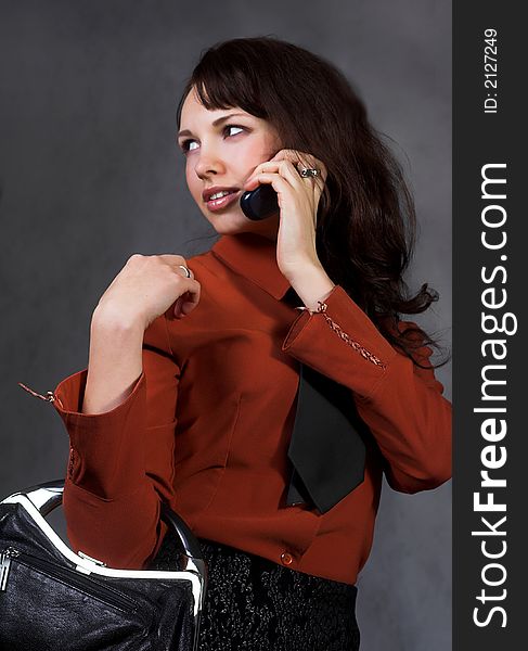 Young businesswoman with mobile phone.