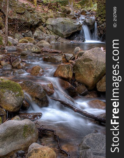 Spring waterfall in the forest. Spring waterfall in the forest