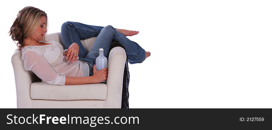 Isolated beautiful blonde girl having relaxing lonely moment on the nice sofa. Isolated beautiful blonde girl having relaxing lonely moment on the nice sofa