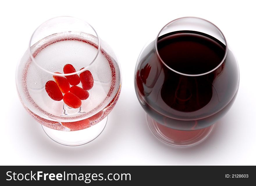 Glasses with true red wine and fake one. Glasses with true red wine and fake one