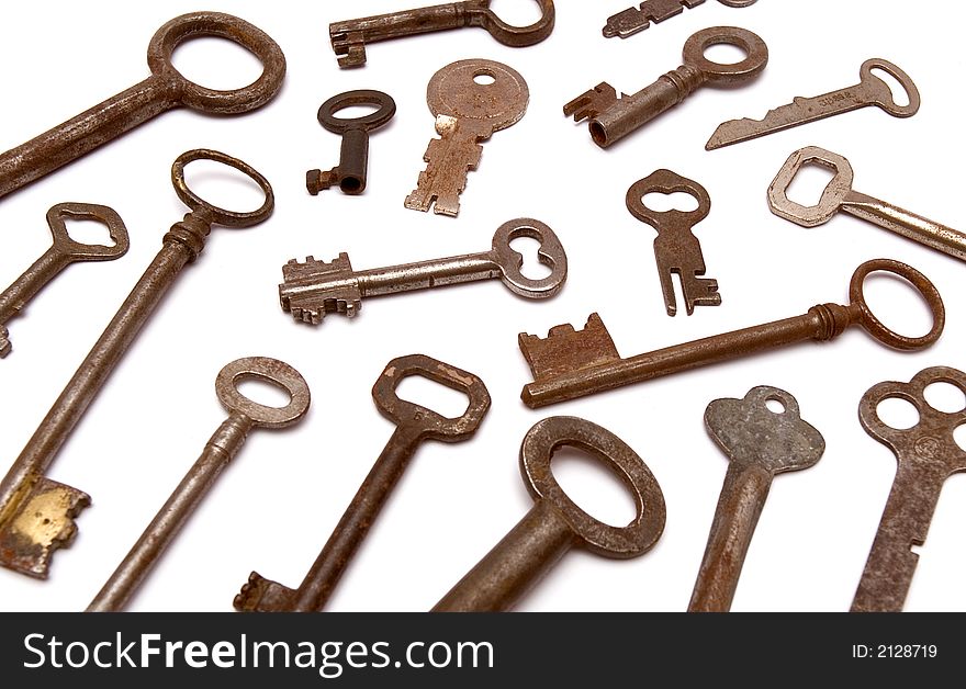 Several vintage keys against a white background. Several vintage keys against a white background