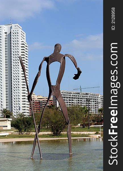 Building and statue reflected in pool of water. Building and statue reflected in pool of water