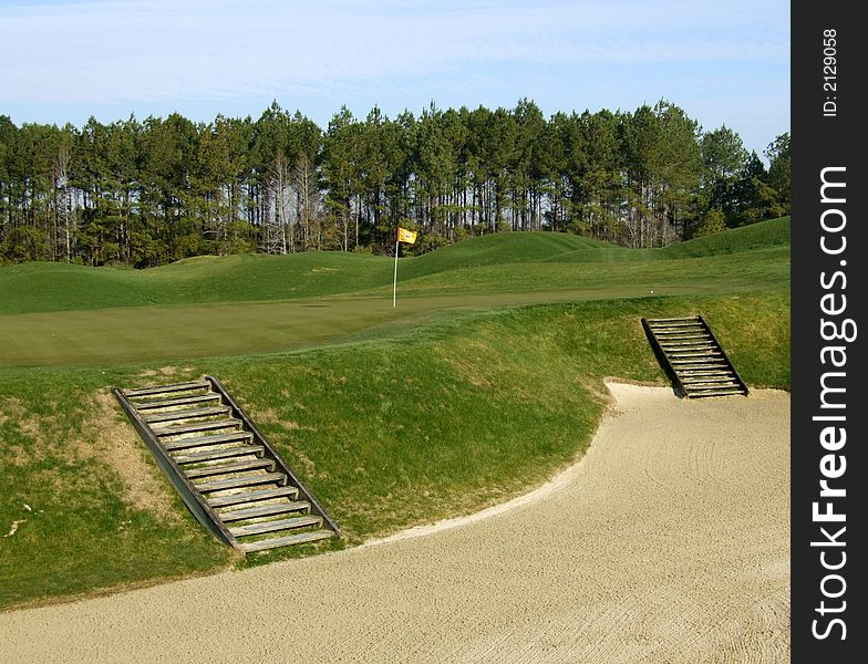 Steps leading out of a sand bunker on a golf course. Steps leading out of a sand bunker on a golf course