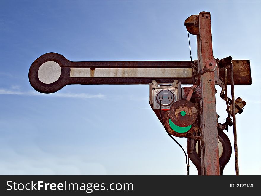 Old rusty train sign bevor blue sky