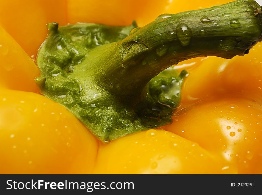 Macro of yellow pepper with drops of water