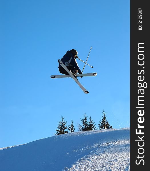 Airborn Skier on a blue background. Airborn Skier on a blue background