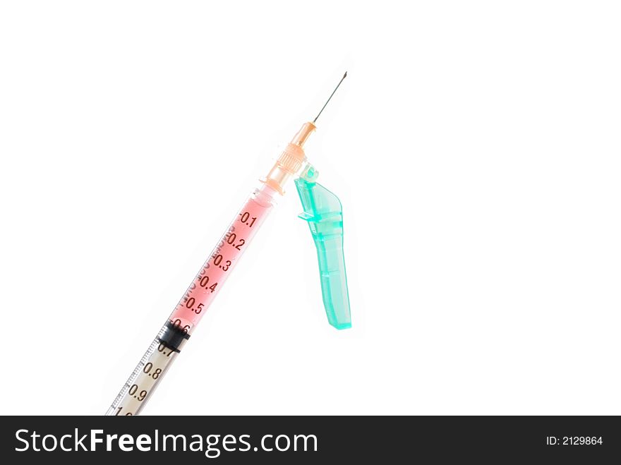 A drug in a needle ready to be used on a white background. A drug in a needle ready to be used on a white background.