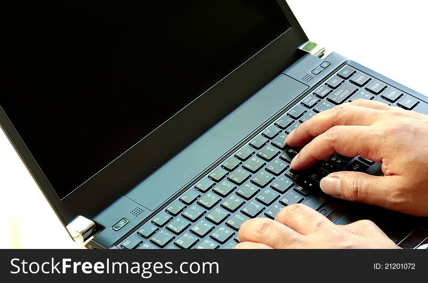 Hand working on notebook computer keyboard. Hand working on notebook computer keyboard