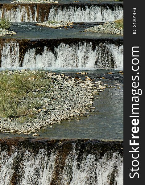 Spring water cascades on a mountain river