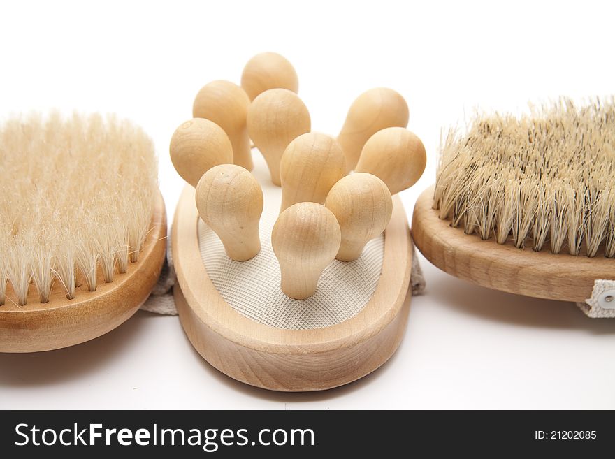 Massage brushes with belt and bristles on white background