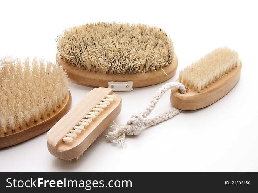 Massage brushes with belt and bristles on white background. Massage brushes with belt and bristles on white background