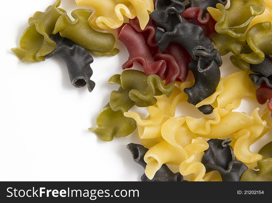 Gigli italian pasta colored on white background. Gigli italian pasta colored on white background