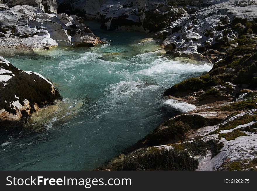 Clear mountain river between rocks and stones. Clear mountain river between rocks and stones