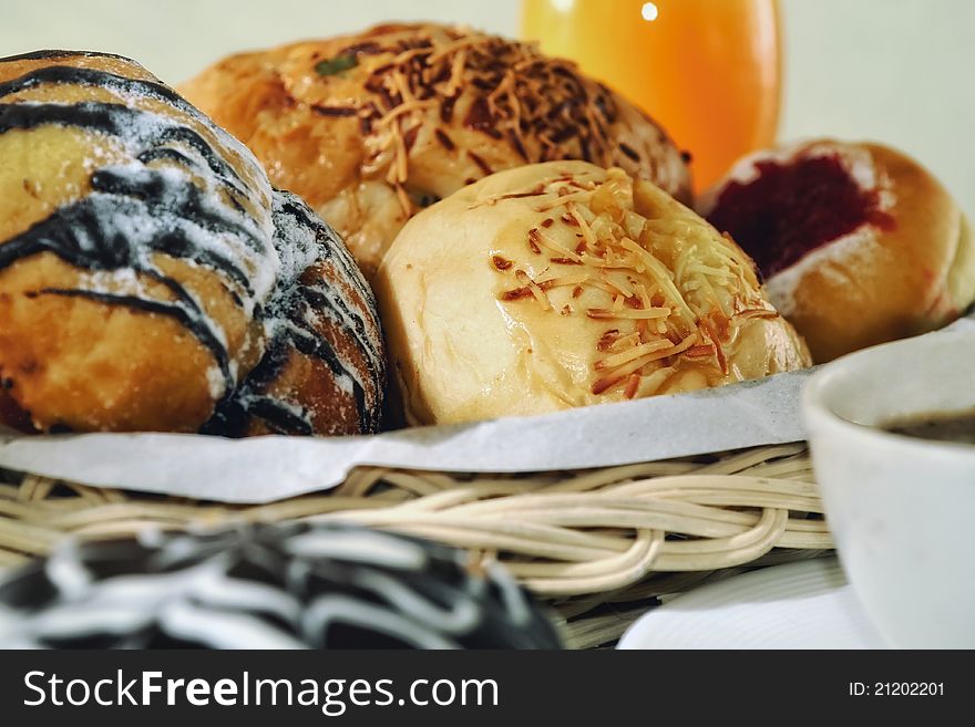 Bread in a basket with morning light. Great images for food and beverages article or any design involving food and drinks. Bread in a basket with morning light. Great images for food and beverages article or any design involving food and drinks.