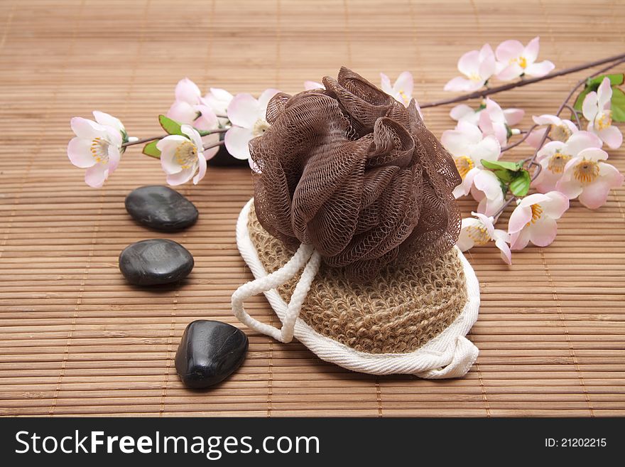 Massage sponge with belt and black stones