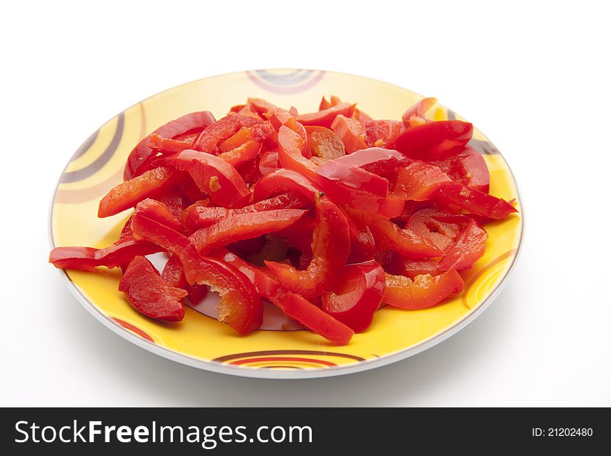 Red pepper in strip chopped and on plate