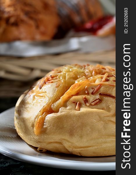 Delicious Cheese bread  served as breakfast. More bread in the basket on background. Great images for food and beverages article or any design involving food and drinks.