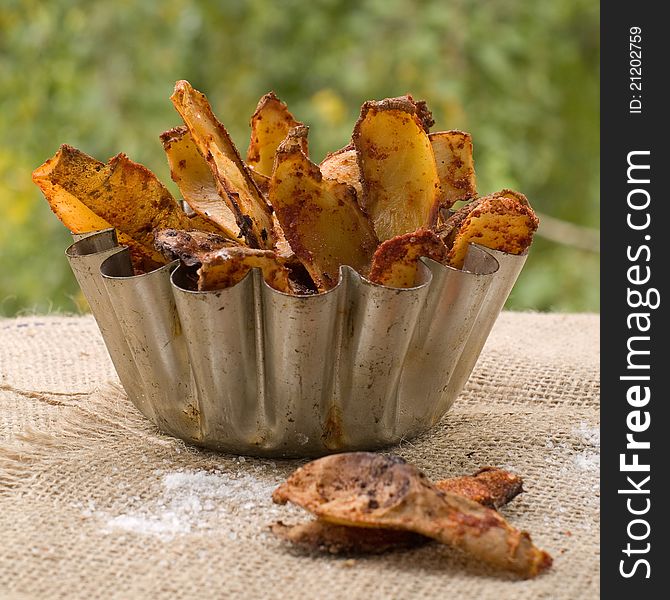 Roasted potatoes with spices in bowl. Selective focus