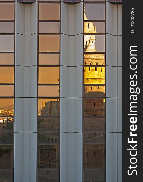 Fishermans Bastion reflected in windows of modern office building in Budapest Hungary. Fishermans Bastion reflected in windows of modern office building in Budapest Hungary
