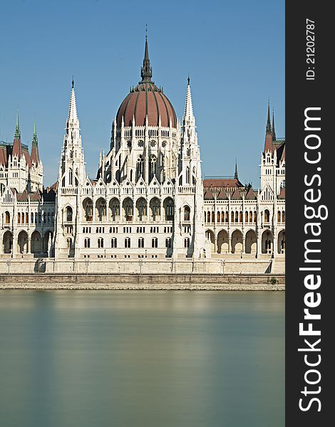 Central portion of the Hungarian parliament building on the blue river danube in Budapest Hungary. Central portion of the Hungarian parliament building on the blue river danube in Budapest Hungary